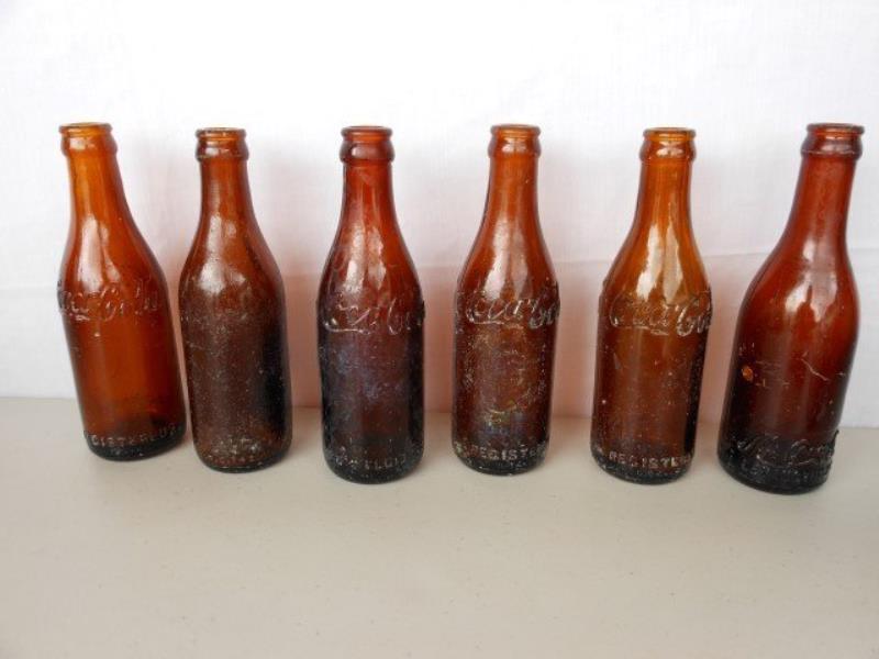 (5) amber Coca-Cola bottles - Lexington, KY; one Mint