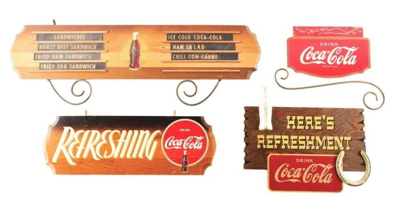 WOOD AND METAL COCA COLA ADVERTISING SIGNS.