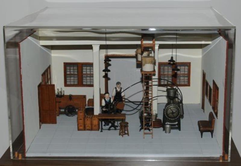 SCALE MODEL OF EARLY COCA-COLA BOTTLING ROOM
