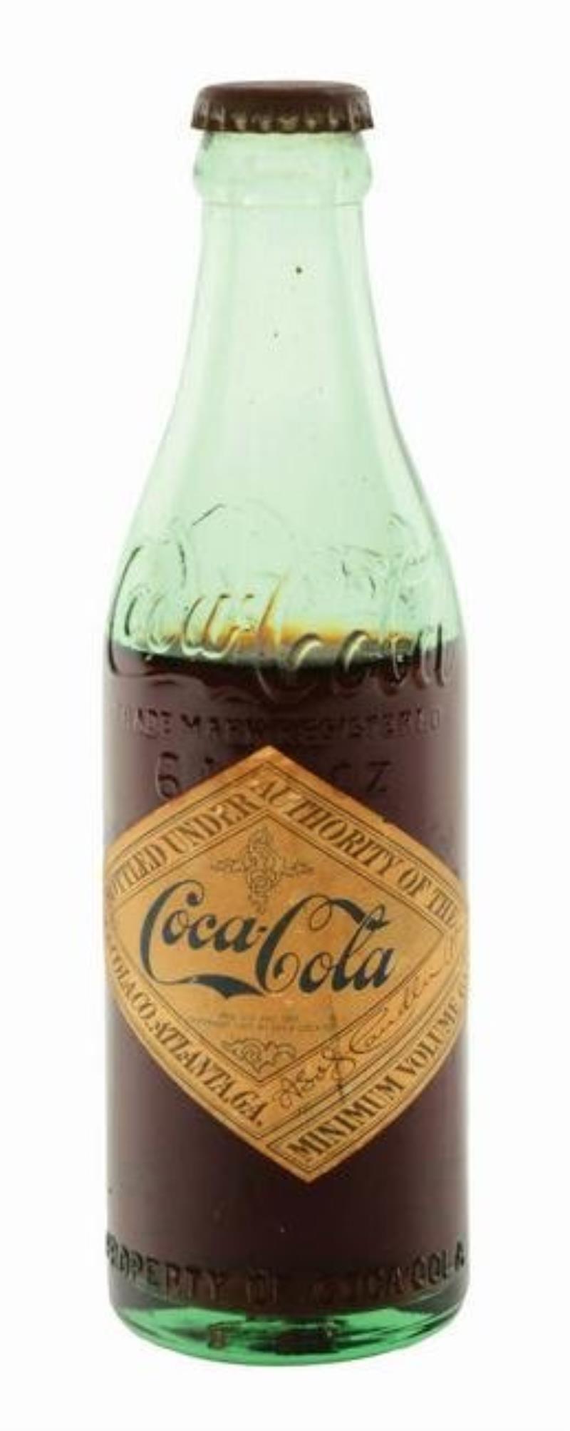 EARLY COCA-COLA BOTTLE WITH PAPER DIAMOND LABEL.