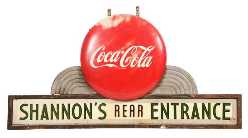 Large Coca-Cola Button on top of Marguee Sign