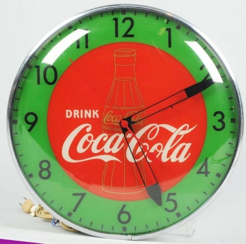 Coca-Cola Pam Light-Up Clock with Gold Bottle.