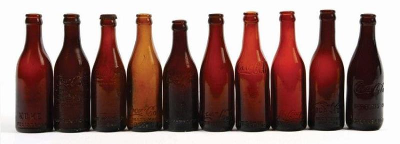 AMBER COCA-COLA BOTTLES.