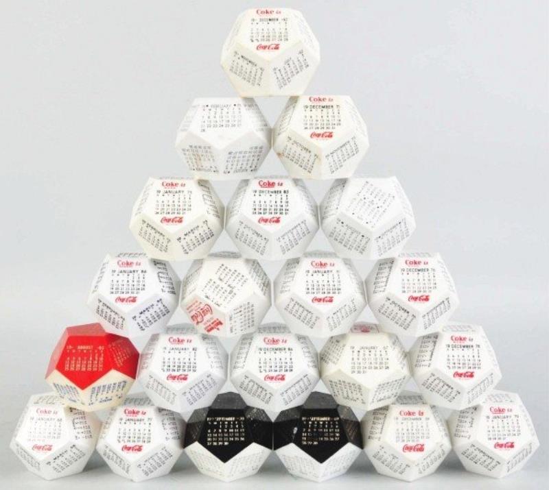 Group of 21 Coca-Cola Desk Calendars.