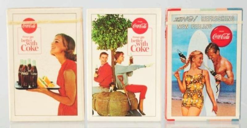 Six packs of Coca-Cola Playing Cards.