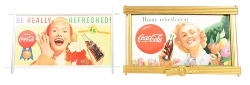 Framed Coca-Cola Advertising Signs.
