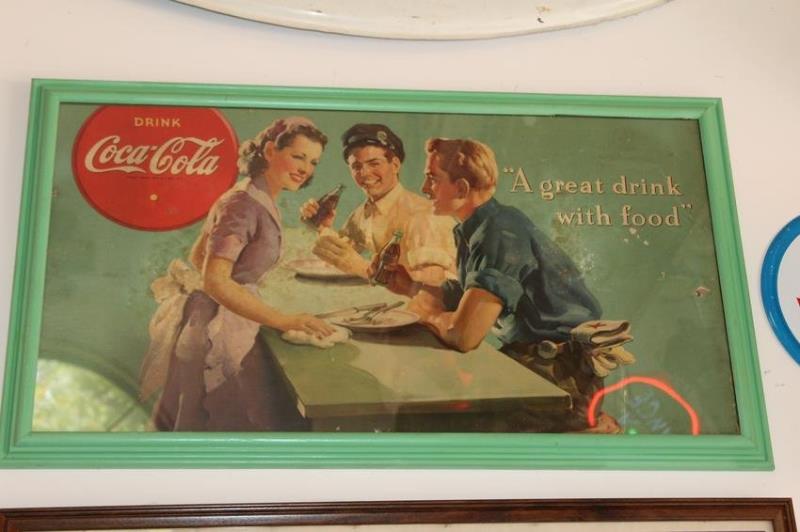 Nicely framed poster advertising Coca Cola. Some wear